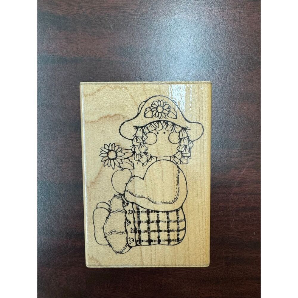 Sarah Doll Sitting and Holding a Flower Rubber Stamp